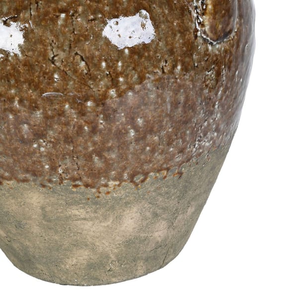Close-up of a ceramic vase or planter with a rustic glazed finish, showing a mottled brown upper section and a matte gray-green lower section on a white background.
A rustic ceramic vase with two side handles, featuring a textured, speckled brown and beige glaze on a plain white background.
vase

neutral vase

mottle effect terracotta vase

modern vase

large vase

large terracotta vase

glazed terracotta vase

distressed vase

Distressed Ceramic Vase with Handles

classic neutral vase

Ceramic Vase with Ha
